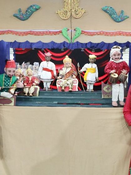 Actors posing in front of our traditional puppet theatre setup, which was a central element of the Zee Marathi show.