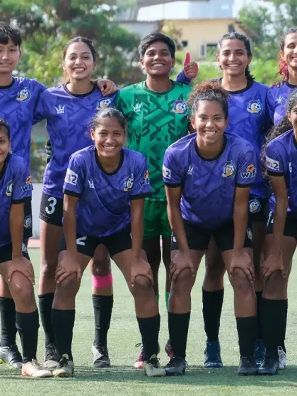 The starting lineup posing for a team photo before a match, looking united and ready to compete.