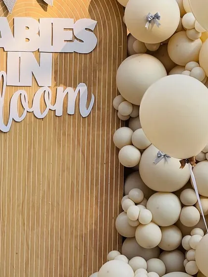 The combination of large and small balloons in a monochromatic scheme creates a visually stunning texture.