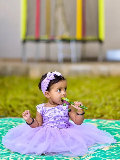 Another candid shot from the same session, showing her curiosity. By giving children the space to play and explore, I can document their natural movements and interactions with the world around them.