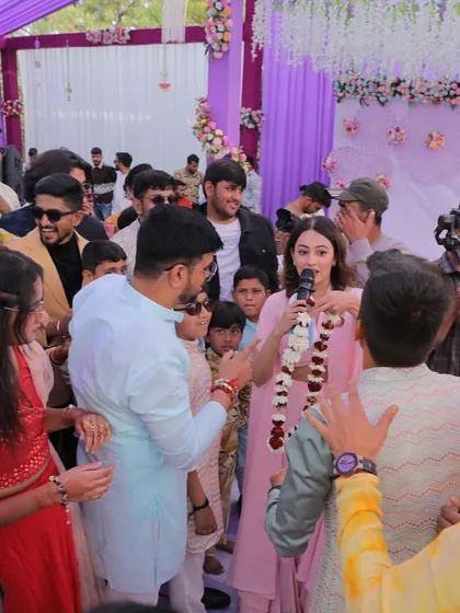 In the middle of the crowd, making sure everyone is part of the game. For me, hosting a Haldi is about creating a circle of fun that includes every single guest.