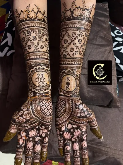 Engagement mehendi is all about celebrating your union. I often include the couple's initials and the special date within the design, as seen here in this intricate pattern with lotus and floral motifs.