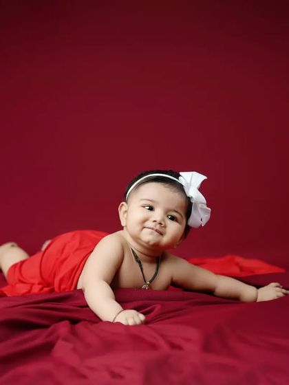This little one is on the move. Capturing babies as they start to crawl is a fun way to document their growing independence and playful spirit.