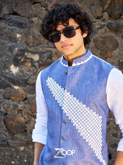 Beat the monsoon blues with a shopping spree. This indigo vest with geometric embroidery over a white shirt is a great example of my comfortable and sophisticated garments.