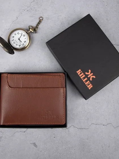 A creative flat-lay of a men's brown leather wallet, shown with its branded box and a vintage-style pocket watch to evoke a sense of classic style and quality.