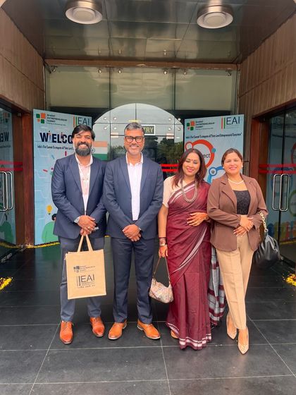Pictured with fellow attendees at the entrance of the summit. Events like these are crucial for discussing how health and wellness are integral to professional success and personal growth.