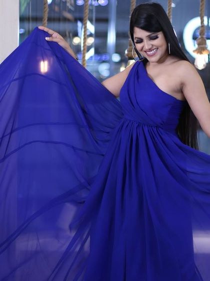 This one-shoulder royal blue gown is all about effortless glamour. The flowing fabric creates beautiful movement, making you feel and look incredible.