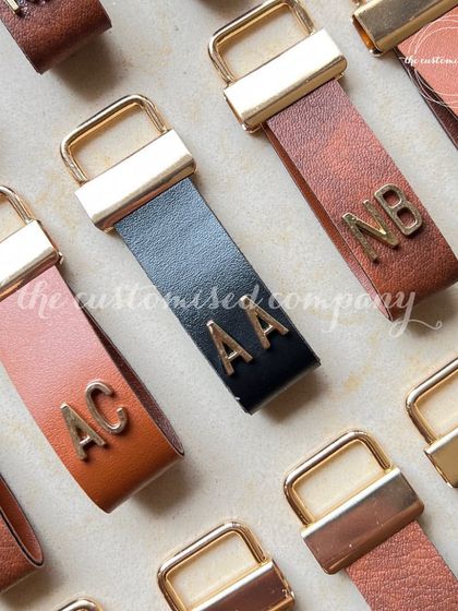 The perfect small gift for your friends. These leather bag charms are personalized with metal initials, adding a touch of custom style to any bag.