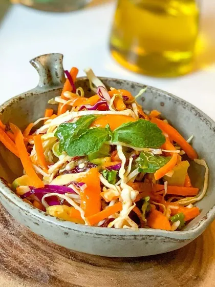 A colorful and crisp Asian slaw from our summer menu. This healthy and flavorful salad is a perfect light meal for a warm day.