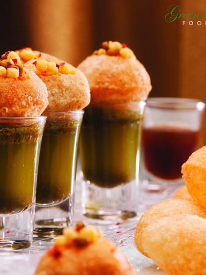 Pani puri served in shot glasses is a modern twist on a classic street food favorite. This presentation is not only stylish but also makes it a convenient and mess free appetizer for guests to enjoy.