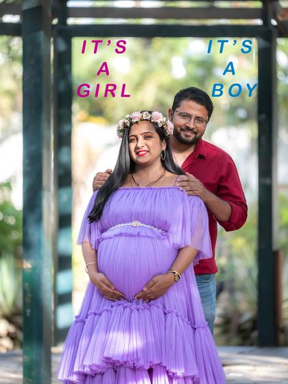 A fun gender reveal photo. The couple is framed in a gazebo, with text indicating "It's a Girl" and "It's a Boy," capturing their excitement.