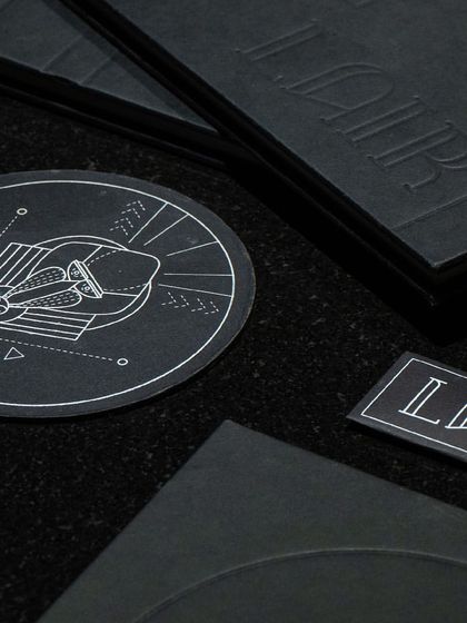 A journey redefined, an unexplored epicurean adventure. The small details, like our custom embossed napkins and geometric coasters, are all part of the Lair experience.