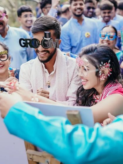 A fun moment where guests are playing a drawing game at the Haldi party.