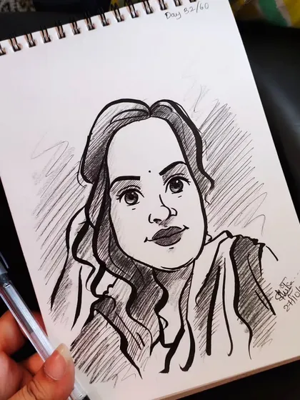 A beautiful caricature portrait with traditional elements. The bindi and the expression give this sketch a lovely, classic feel.