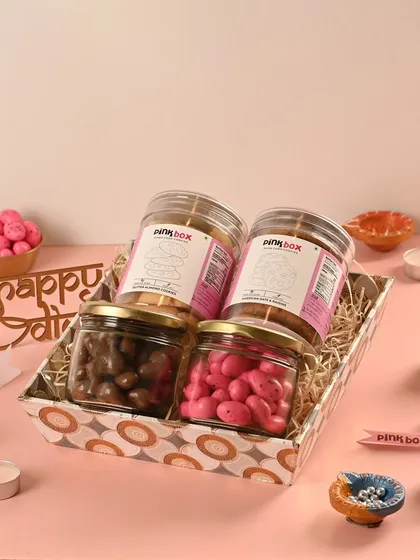 The "Utsav" hamper is a celebration of flavors, combining our Butter Almond and Oat & Raisin cookies with Pink Almond Dragees and Chocolate Coated Cashews.