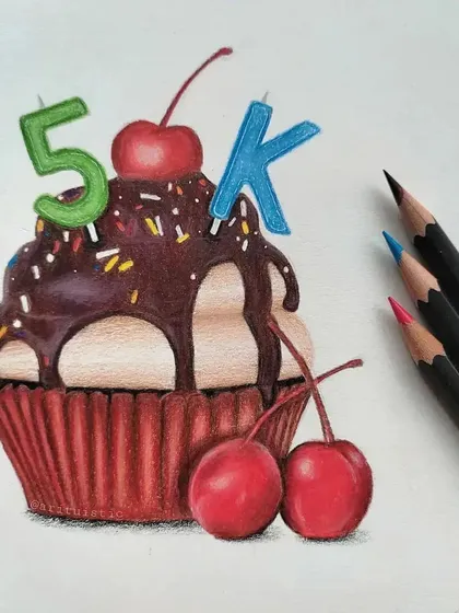 Another angle of the finished 5K cupcake, showing the glossy chocolate frosting and realistic cherries.
