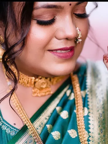 A close-up of the engagement makeup, showing the delicate shimmer on the eyes and the nude pink lip.