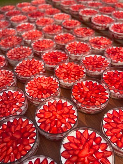An army of my Strawberry & Cream Cheese Trifles, all topped with beautifully arranged fresh strawberries. Perfect for party catering or bulk gifting.