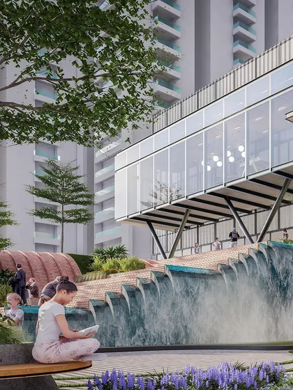For the Myhome Vipina clubhouse in Hyderabad, we designed the space between buildings to be the true heart of the project. This view shows how we integrated a cascading waterfall and lush gardens, transforming a simple pathway into a serene, multi-sensory experience for residents.