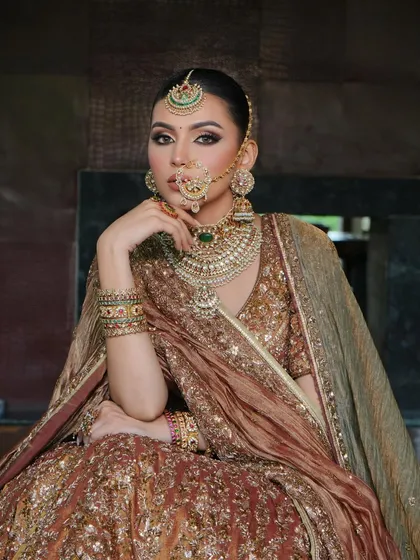 A final portrait from this series, capturing the bride's serene beauty and the impeccable styling of her outfit.