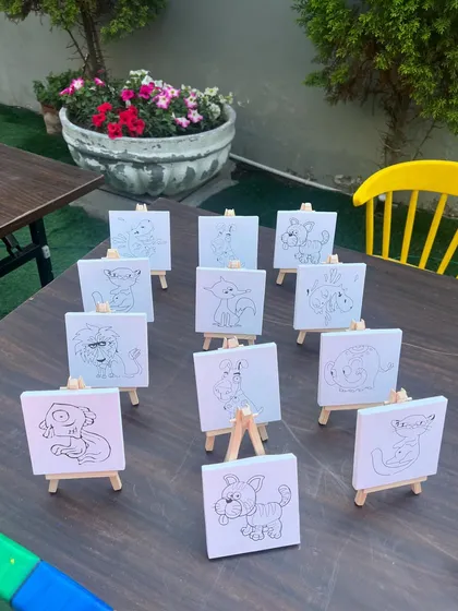 Mini canvases with animal outlines ready for a party painting activity. It's a perfect party favor that the kids create themselves.