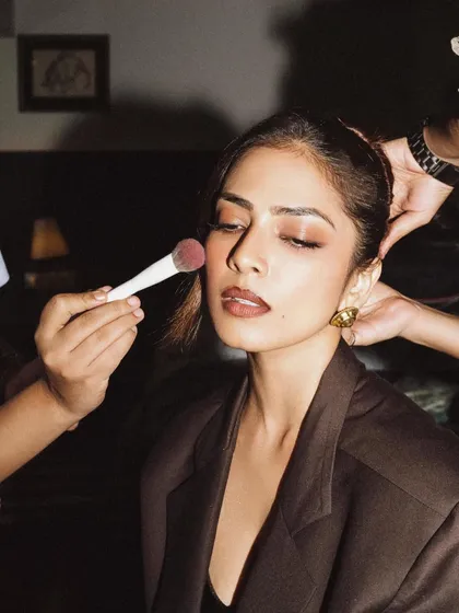 A quiet moment behind the scenes with the wonderful Malavika Mohanan. This shot is about the process, the trust, and the artistry that goes into creating a look before the main event, capturing the calm before the storm.