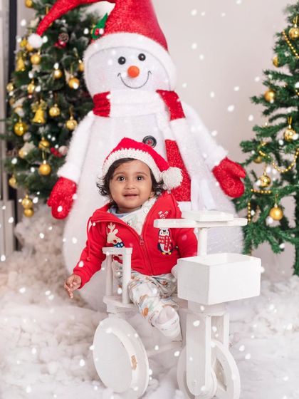 Another magical moment in the snow, with this little one enjoying the festive atmosphere of our Christmas setup.