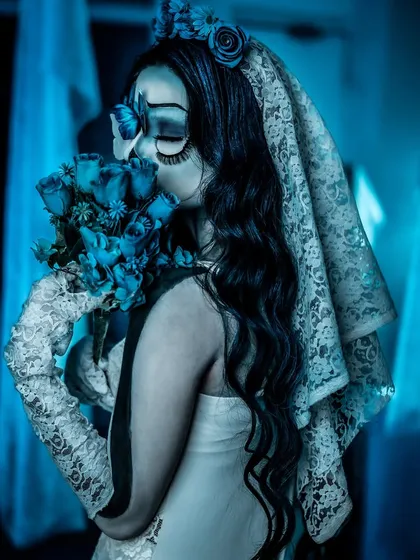 A side profile of the Corpse Bride, showing the details of the makeup and the delicate lace veil. This is a great example of our students' work in character creation.