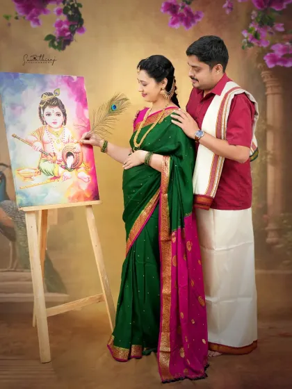 A divine Krishna-inspired portrait where the mother-to-be interacts with a painting of baby Krishna. The rich colors and traditional attire create a deeply symbolic and artistic image.