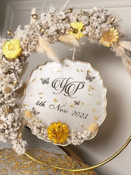 A close-up of the beautiful floral arrangement on the hoop, showing the texture of the dried flowers.