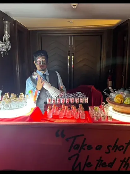 A custom shot bar with a sign that reads 'Take a shot, we tied the knot'. It's a fun and personal touch that encourages guests to celebrate the newlyweds.