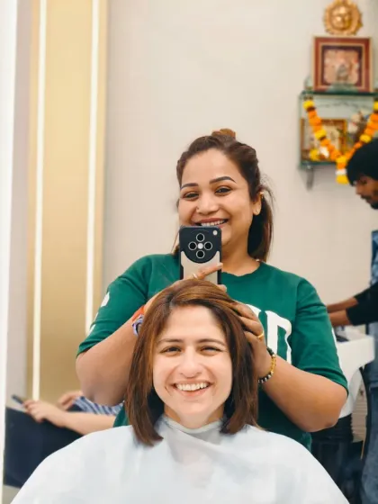 Capturing the happy moment right from the salon chair. A fresh haircut and color always brings out the biggest smiles.