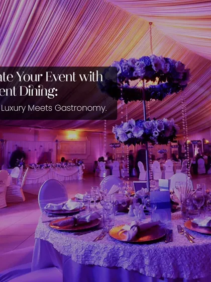 Elevate your event with opulent dining. This wide shot of a beautifully decorated ballroom with purple lighting and floral centerpieces shows where luxury meets gastronomy.