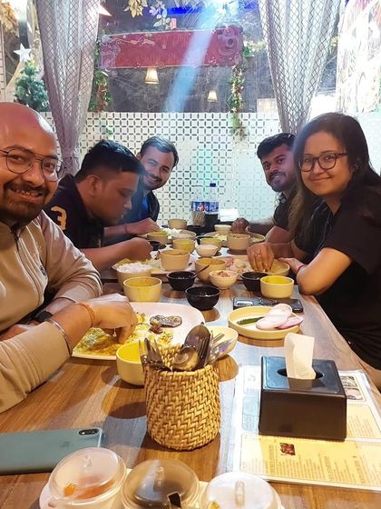 Smiles all around the table. This is what it's all about, bringing people together over good, authentic food.