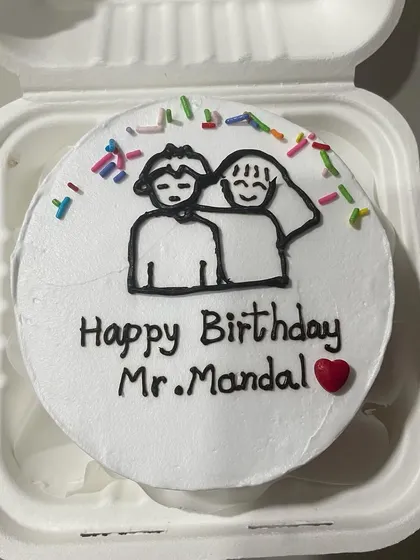 A cute couple-themed bento cake with a simple drawing and colorful sprinkles for 'Mr. Mandal'.