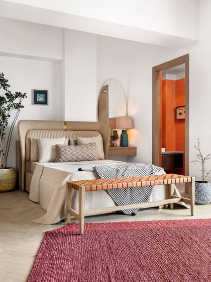 This guest bedroom in a Mumbai apartment blends simple elegance with boho chic vibes. Soft hues, natural textures, and a comfortable layout create a serene atmosphere for guests to unwind.