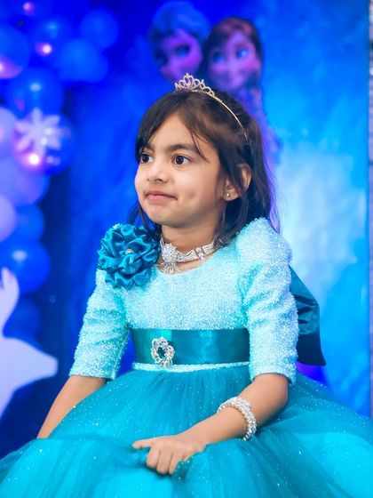 A playful 'Mickey Mouse' themed birthday party, with bright colors, character cutouts, and a fun balloon arch, creating a joyful atmosphere for little ones.