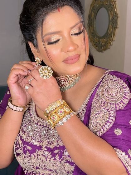 Adjusting her earrings, she looks absolutely radiant. This transformation reminds me why I love my job.