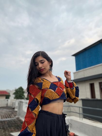 I love how the colors pop against the sky in this photo. This top is a true labor of love, and wearing it always makes me feel so creative and confident.