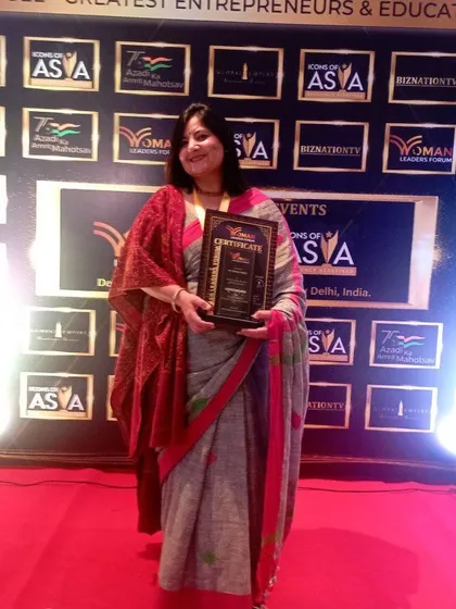 Holding my award at the Greatest Entrepreneurs & Educators event. My mission is to help women build the skills and confidence to succeed in all areas of life.