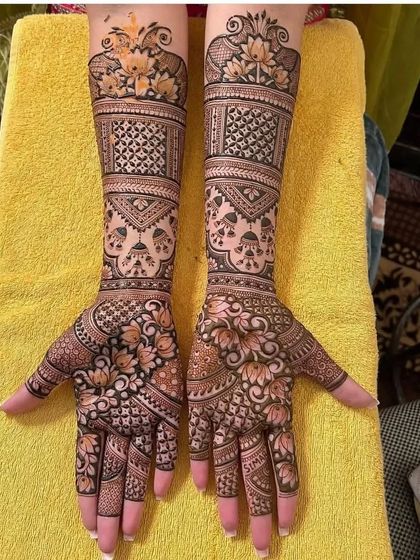 This design features lotus and jhumka (earring) motifs, creating a beautiful and feminine look.