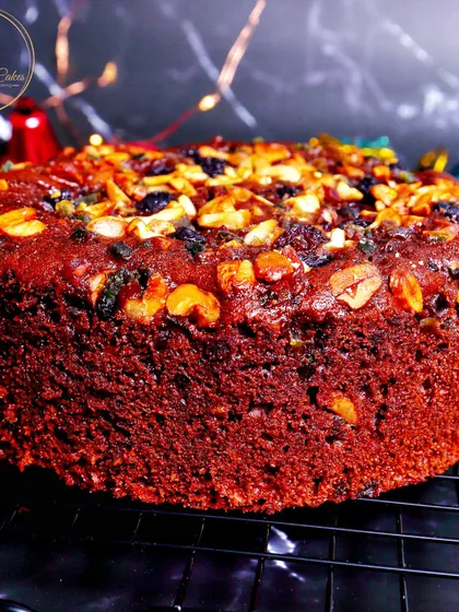 My classic Christmas plum cake is a festive favorite, made without any alcohol. It's incredibly moist and dense, packed with a generous amount of premium soaked fruits and nuts, offering a rich, traditional flavor in every bite.