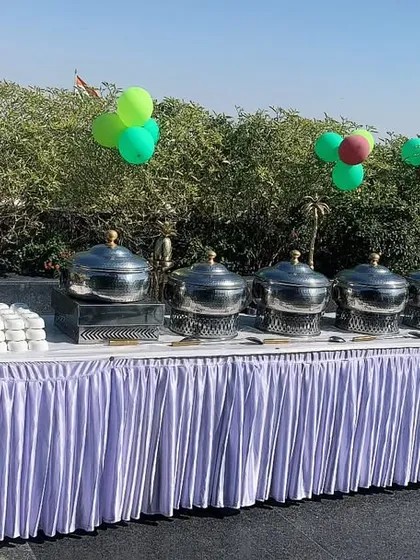 A beautiful daytime party with colorful balloons and a fresh outdoor buffet. This setup is perfect for birthdays, anniversaries, or any cheerful celebration.