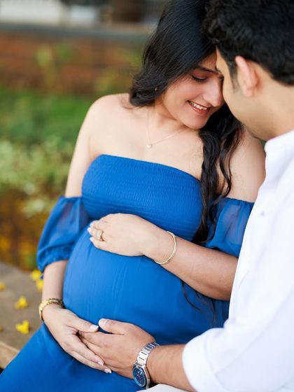 A close-up shot focusing on their hands on the baby bump. It’s a tender portrait that highlights their connection and the shared love for their unborn child.