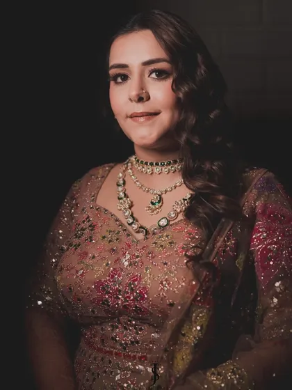 A closer look at the Sangeet ensemble. We layered her jewelry to add a touch of modern playfulness to the traditional lehenga, creating a look that was perfectly balanced.
