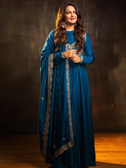 For this photoshoot, I styled singer Priyanka Barve in a deep teal blue Anarkali with intricate gold embroidery. This is a regal and timeless look.