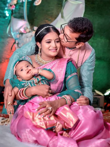 A beautiful family portrait from a naming ceremony. The new mom looks radiant and happy.