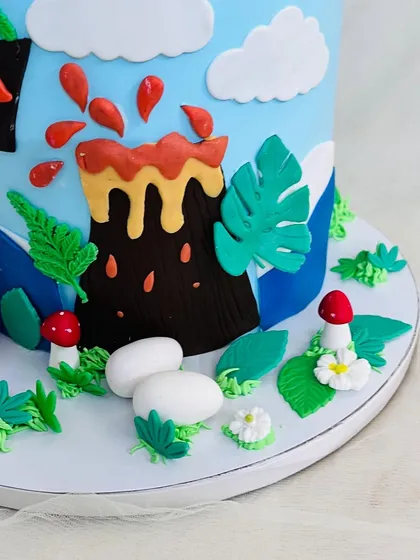 A close-up of the erupting volcano and dinosaur eggs.