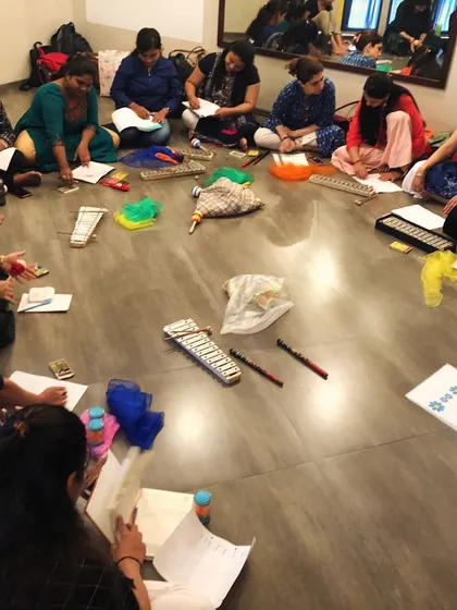 This is what our teacher training looks like: a collaborative, hands-on session where educators learn to design their own play-based music curriculum. Here, our trainees are working together on lesson plans, surrounded by instruments and creative materials.
