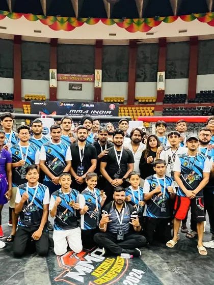 Team Delhi standing proud inside the cage at the national championship. This is our parivaar, united and strong, celebrating our collective success on a national stage.